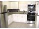 Renovated kitchen, featuring stainless steel appliances and granite countertops at 925 67Th S St, St Petersburg, FL 33707