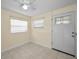 Living room with tile floors, ceiling fan, fresh paint and a lot of light at 925 67Th S St, St Petersburg, FL 33707