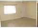 Spacious living room featuring tile flooring and a ceiling fan at 925 67Th S St, St Petersburg, FL 33707