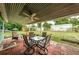 Covered patio with seating area and backyard view at 925 67Th S St, St Petersburg, FL 33707