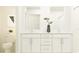 Elegant bathroom with double vanity and white cabinets at 9354 Runaway Breeze Dr, Land O Lakes, FL 34637