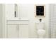 Small bathroom with white vanity, toilet, and shower at 9354 Runaway Breeze Dr, Land O Lakes, FL 34637