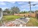 Backyard with grass, patio, and wooden fence at 9850 55Th N Way, Pinellas Park, FL 33782