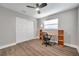 Bedroom with double door closet and wood-look flooring at 9850 55Th N Way, Pinellas Park, FL 33782