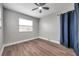 Bright bedroom with wood-look floors and window at 9850 55Th N Way, Pinellas Park, FL 33782