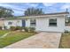 House exterior with walkway and landscaping at 9850 55Th N Way, Pinellas Park, FL 33782