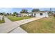 Front yard view of the house and driveway at 9850 55Th N Way, Pinellas Park, FL 33782