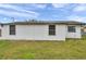 White house exterior with a spacious yard at 9850 55Th N Way, Pinellas Park, FL 33782