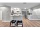 Modern kitchen with white cabinets and bar stools at 9850 55Th N Way, Pinellas Park, FL 33782