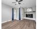 Living room featuring a fireplace and built-in shelving at 9850 55Th N Way, Pinellas Park, FL 33782