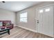 Living room with white door and window at 9850 55Th N Way, Pinellas Park, FL 33782