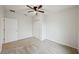 Well-lit bedroom featuring carpet floors, a closet, and an exterior view at 10509 Massimo Dr, Wimauma, FL 33598