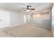 Large bedroom with ceiling fan and carpet at 16116 Loneoak View Dr, Lithia, FL 33547