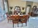 Formal dining room with wood table and chairs, hardwood floors, and access to patio at 16754 Ivy Lake Dr, Odessa, FL 33556