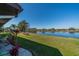 Enjoy lush landscaping and water views in this peaceful backyard setting at 1723 Wolf Laurel Dr, Sun City Center, FL 33573