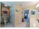 Bathroom with a toilet, vanity with sink, and access to the bedroom at 1723 Wolf Laurel Dr, Sun City Center, FL 33573