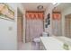 Full bathroom featuring a floral shower curtain, toilet, and vanity with sink at 1723 Wolf Laurel Dr, Sun City Center, FL 33573