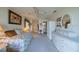 Bedroom with a day bed, ceiling fan, and neutral carpet at 1723 Wolf Laurel Dr, Sun City Center, FL 33573