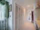 Hallway with closet storage leading to the bathroom at 1723 Wolf Laurel Dr, Sun City Center, FL 33573