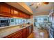 Kitchen and dining area features a seamless design with granite countertops and updated stainless appliances at 1723 Wolf Laurel Dr, Sun City Center, FL 33573