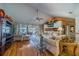 Spacious living room offers beautiful lake views through sliding glass doors and lots of seating at 1723 Wolf Laurel Dr, Sun City Center, FL 33573