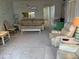 Condo living room featuring light-colored furniture and carpeting at 17580 Gulf Blvd # 320, Redington Shores, FL 33708