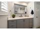 Modern bathroom with gray vanity and quartz countertop at 1761 Eaton Ne Dr, Clearwater, FL 33756