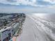 Wide aerial view of coastline, showing beach and buildings at 19440 Gulf Blvd # 301, Indian Rocks Beach, FL 33785