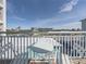 Balcony with table and chairs, offering scenic views at 19440 Gulf Blvd # 301, Indian Rocks Beach, FL 33785