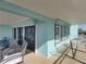 Spacious balcony with seating, hammock, and ocean view at 19440 Gulf Blvd # 301, Indian Rocks Beach, FL 33785