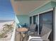 Relaxing balcony with outdoor furniture and ocean view at 19440 Gulf Blvd # 301, Indian Rocks Beach, FL 33785
