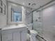 Modern bathroom with white cabinets and walk-in shower at 19440 Gulf Blvd # 301, Indian Rocks Beach, FL 33785