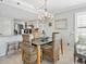 Bright dining area with wicker chairs and glass table at 19440 Gulf Blvd # 301, Indian Rocks Beach, FL 33785