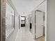 Bright condo entryway with mirror and access to rooms at 19440 Gulf Blvd # 301, Indian Rocks Beach, FL 33785