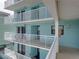 Exterior view of condo building showing balconies and walkways at 19440 Gulf Blvd # 301, Indian Rocks Beach, FL 33785
