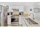 Modern kitchen with stainless steel appliances and granite countertops at 19440 Gulf Blvd # 301, Indian Rocks Beach, FL 33785