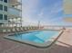 Inviting community pool with ample lounge chairs at 19440 Gulf Blvd # 301, Indian Rocks Beach, FL 33785