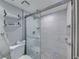 Walk-in shower with marble tile and modern fixtures at 19440 Gulf Blvd # 301, Indian Rocks Beach, FL 33785