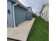 Landscaped backyard with gravel and grassy area at 2048 Tumbleweed Dr, Holiday, FL 34690