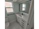 Modern bathroom with white vanity, quartz countertop, and marble tile at 2048 Tumbleweed Dr, Holiday, FL 34690