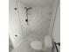 Updated bathroom with marble shower and neutral tile at 2048 Tumbleweed Dr, Holiday, FL 34690