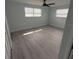 Bedroom with ceiling fan, vinyl flooring and large closet at 2048 Tumbleweed Dr, Holiday, FL 34690