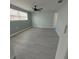 Bright bedroom with ceiling fan and laminate flooring at 2048 Tumbleweed Dr, Holiday, FL 34690