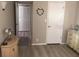 A bright hallway with doors to bedrooms and closets at 2060 Marilyn St # 103, Clearwater, FL 33765