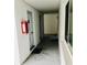 Clean and well-lit hallway leading to units at 2060 Marilyn St # 103, Clearwater, FL 33765