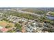 Aerial view of neighborhood with lake, showcasing property location at 2124 16Th Sw Ave, Largo, FL 33770