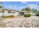 Backyard view showcasing patio and surrounding landscape at 2124 16Th Sw Ave, Largo, FL 33770