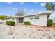 Spacious backyard with covered patio and a sandy area at 2124 16Th Sw Ave, Largo, FL 33770