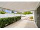 Covered patio with access to backyard and sliding doors at 2124 16Th Sw Ave, Largo, FL 33770