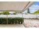 Covered patio, fenced backyard, and well-maintained landscaping at 2124 16Th Sw Ave, Largo, FL 33770
